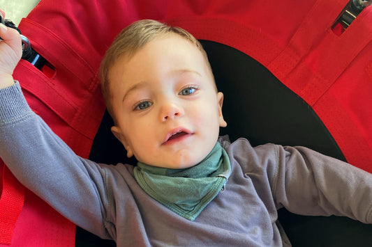 A toddler on a sensory swing