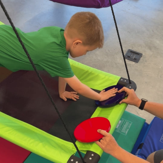 Various individuals enjoying sensory integration activities with the SensoryRx Platform Swing